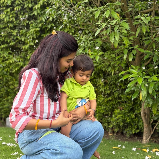 Mohini spending time outdoors with her young child